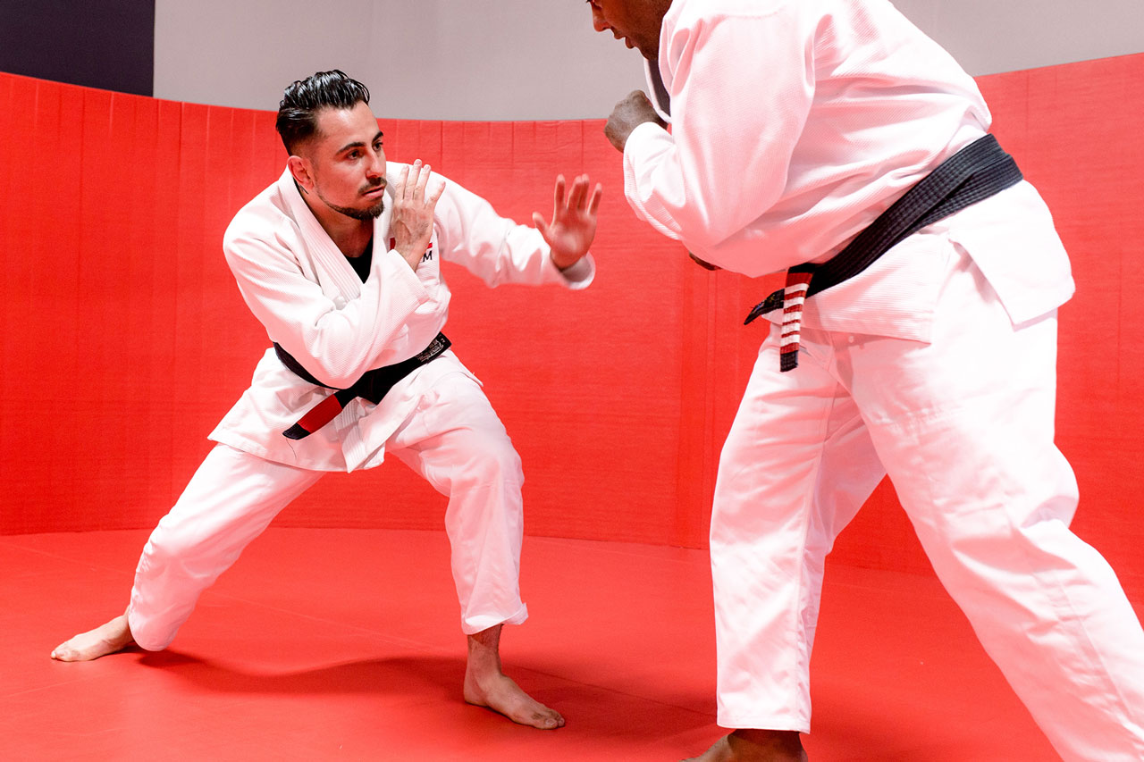 Two members practicing brazilian jiu jitsu
